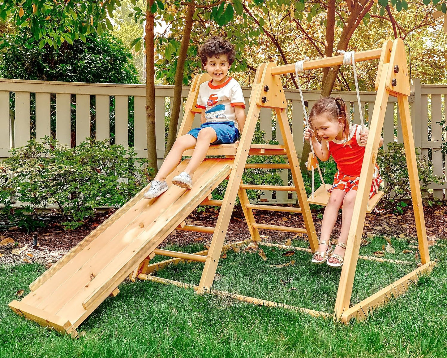 4-In-1 Juniper Outdoor Play Gym - Jungle Gym Playset with Baby Swing, Slide, Ladder, and Climbing Wall - Foldable Wooden Playset - Outdoor Jungle Gym for Kids Ages 18Mo to 6Yrs