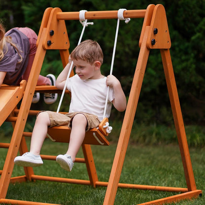 4-In-1 Juniper Outdoor Play Gym - Jungle Gym Playset with Baby Swing, Slide, Ladder, and Climbing Wall - Foldable Wooden Playset - Outdoor Jungle Gym for Kids Ages 18Mo to 6Yrs