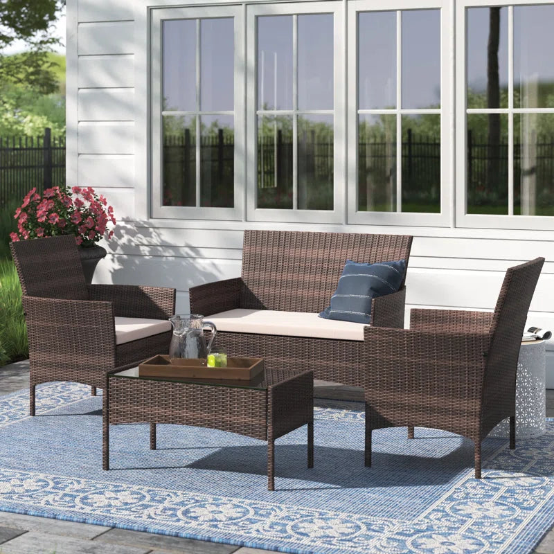 Randlett 4 - Person Rectangular Outdoor Dining Set with Cushions